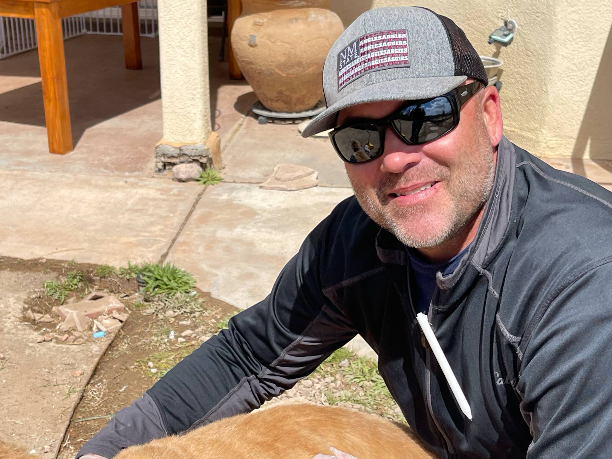 Cruces Scoopers owner working in a Las Cruces customer yard