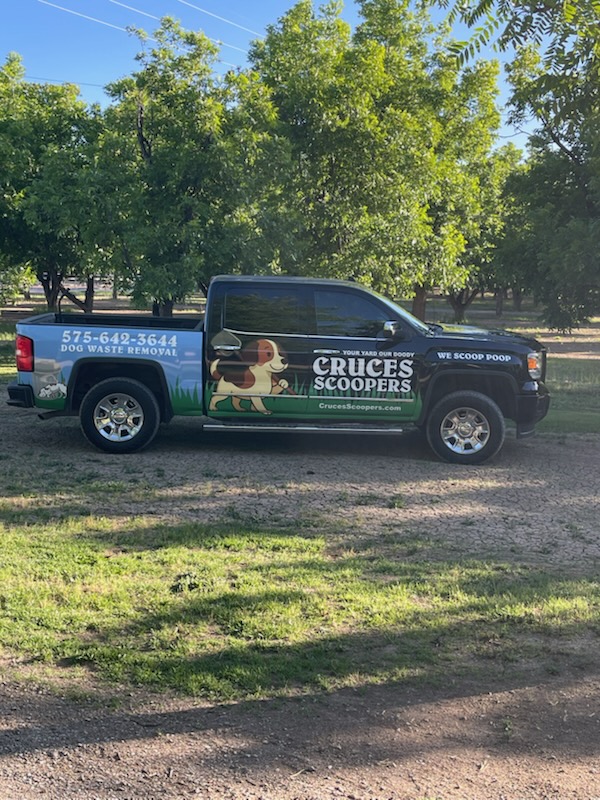 Cruces Scoopers branded truck serving a Las Cruces neighborhood