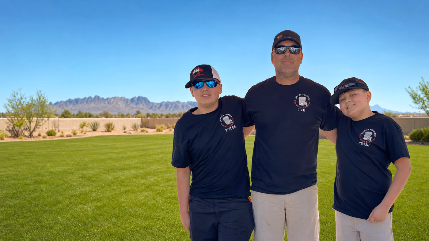 The Cruces Scoopers family team standing in a clean Las Cruces yard