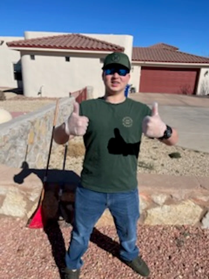 Cruces Scoopers family crew member ready for a residential cleanup route