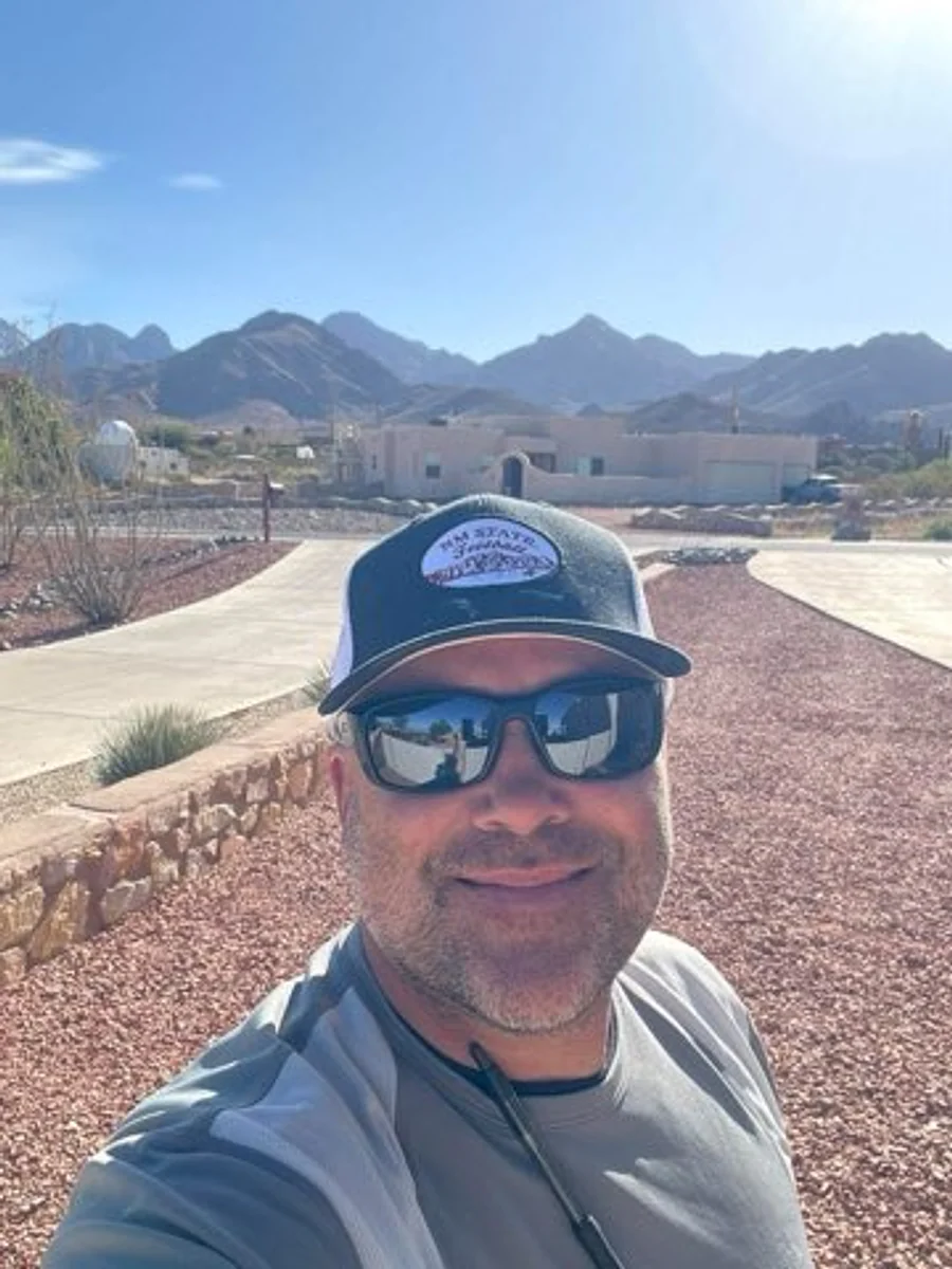 Cruces Scoopers owner on a Las Cruces route beneath the Organ Mountains